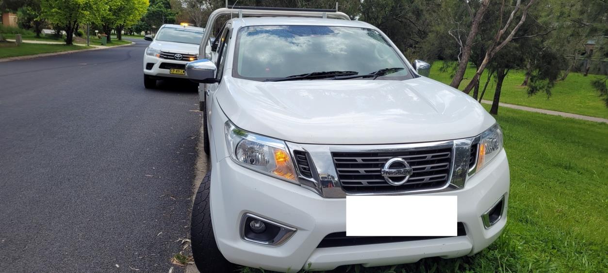 White Nissan ute front view