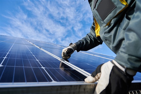 Solar panels being installed on rooftop house