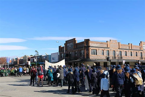 This is an Image of school children walking along Monaro Street Queanbeyan during the 2017 Reconciliation walk