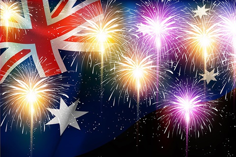 Image of fireworks over an Australian flag