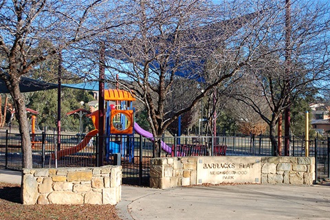 Baracks Flat Neighbourhood Park showing fenced playground with shade sails