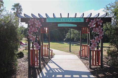 Wooden entrance gate into Sister City park