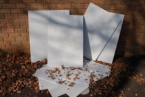 White election signs in pile