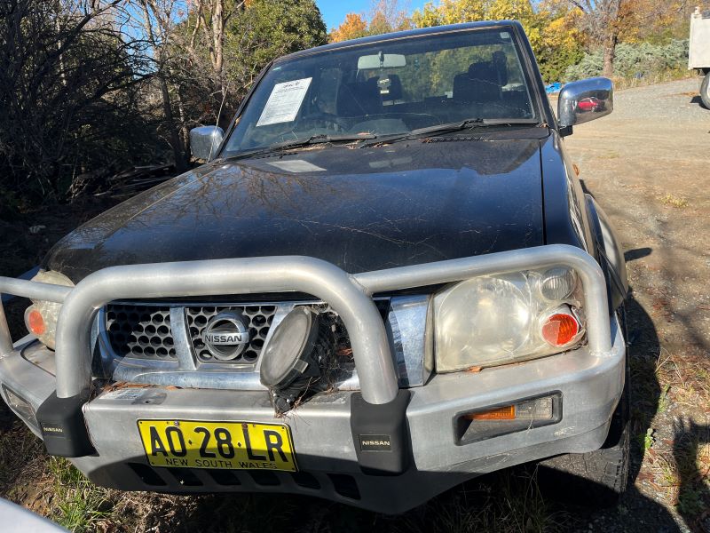 Black Nissan twin cab front of vehicle