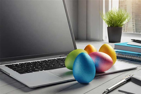 Easter eggs sitting on a laptop keyboard