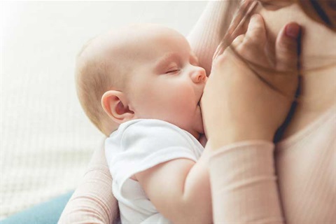 Mother breastfeeding infant