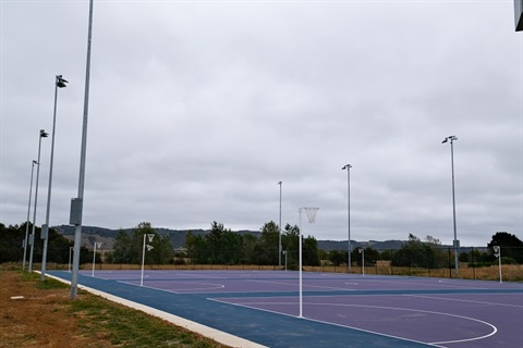 Hard floor netball courts with spotlights 