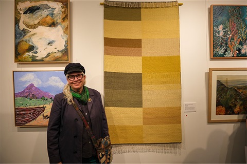 Winning artist Alison Alder with her weaving work Budawang 2 from the 2025 Art Awards