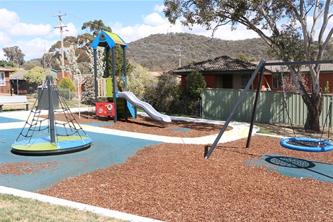 Banksia Park showing basket swing, climbing frame and slide