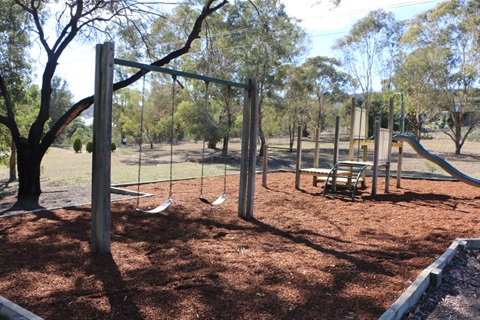 Bywong Park in Queanbeyan showing swings, slide and climbing equipment