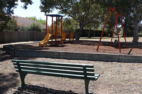 Halloran Drive Community Park showing swings and slide