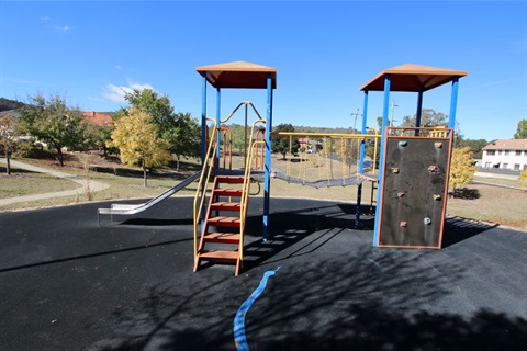 Tennyson Mews park showing climbing wall, slide and softfall