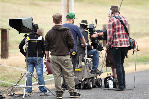 Crew filming on street