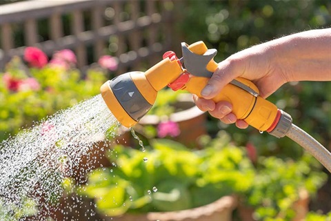 Hand watering using a hose